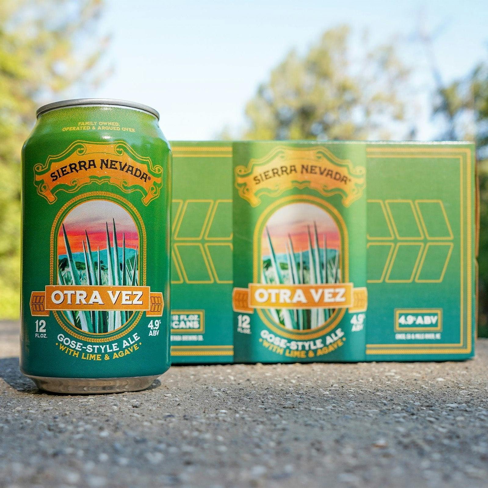 Sierra Nevada Otra Vez can sitting on a gravel surface in front of its 6-pack box