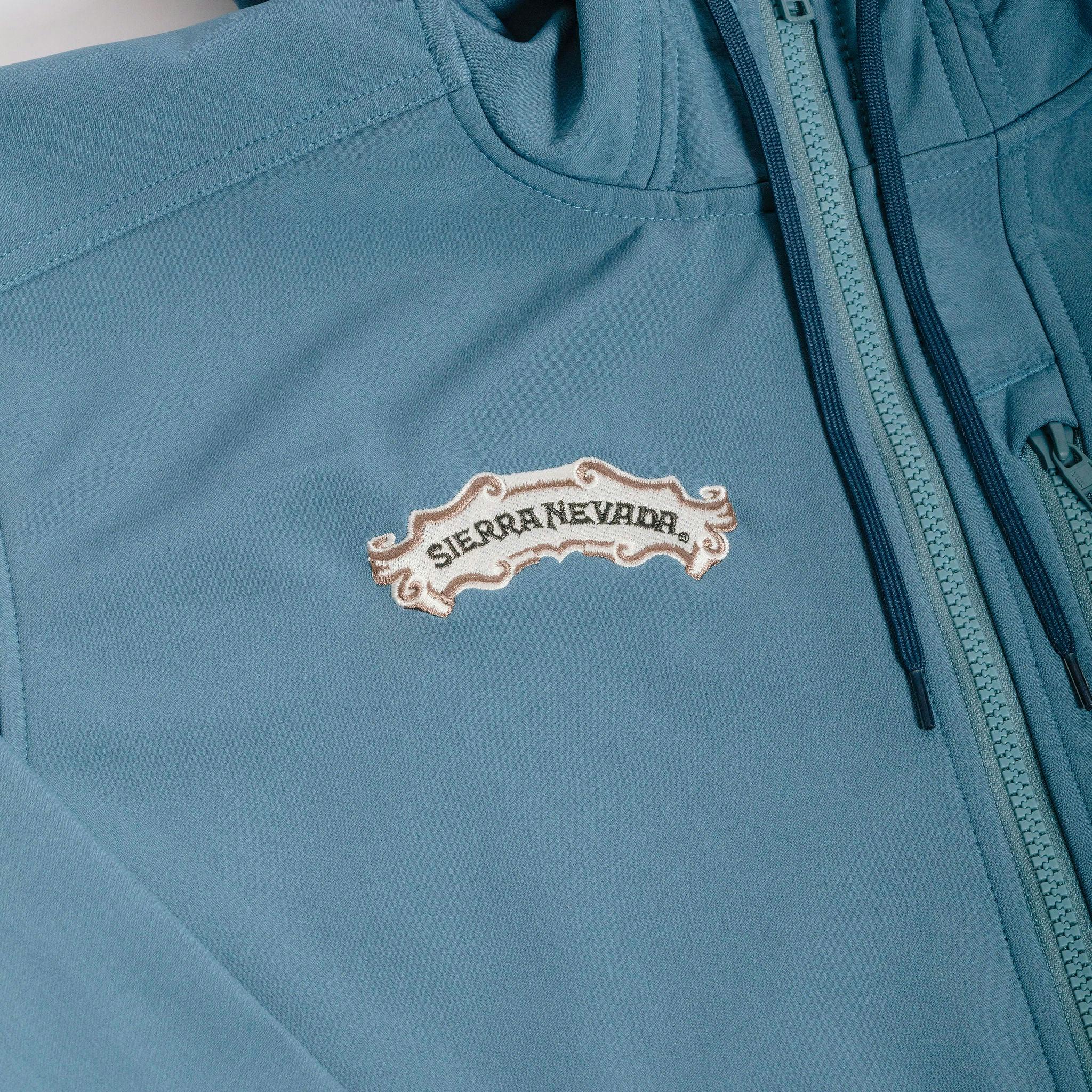 Sierra Nevada x Simms Rogue Fleece Hoody - detail of embroidered scroll logo