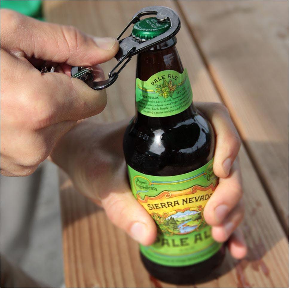 Sierra Nevada S-Biner Carabiner Bottle Opener used to crack open a bottle of Pale Ale