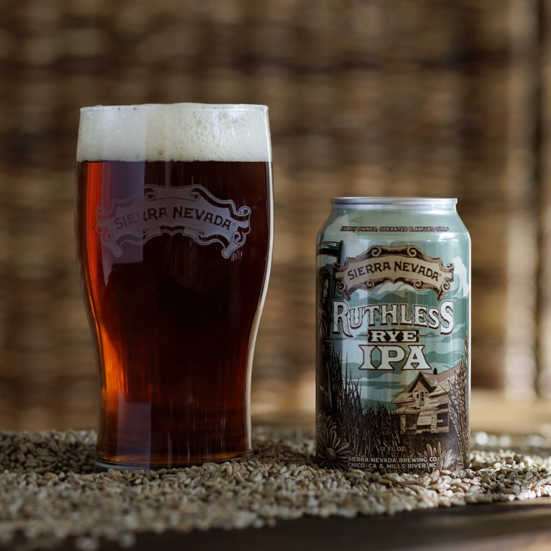 Ruthless Rye 12oz. can and beer in pint glass
